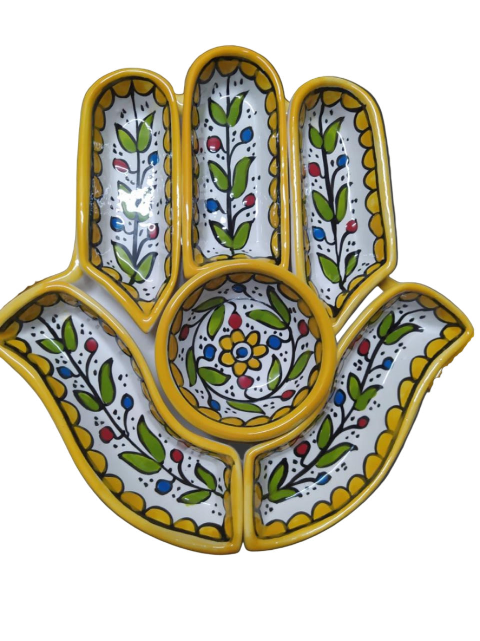 Decorative ceramic dish with floral patterns on a white surface